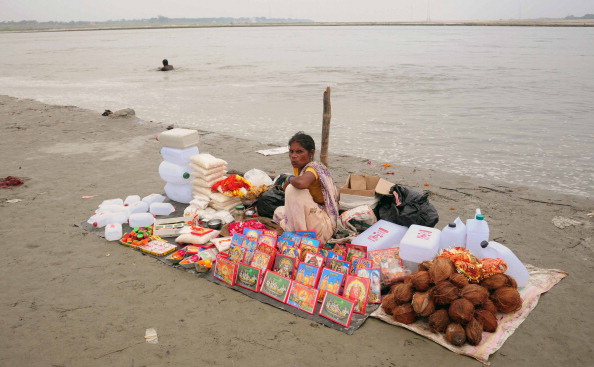 A vendor waits for customers at bank of River Ganga in