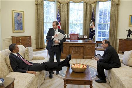 White House handout shows U.S. President Obama talks with Deputy National Security Advisor for Strategic Communication Rhodes and Senior Advisor Axelrod in the Oval Office
