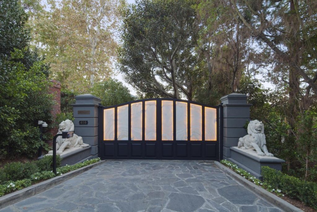 the-home-sits-on-two-acres-of-property-and-both-of-its-bel-air-entrances-are-gated-rogers-was-the-owner-to-add-those-lions-to-the-gate-hes-a-leo