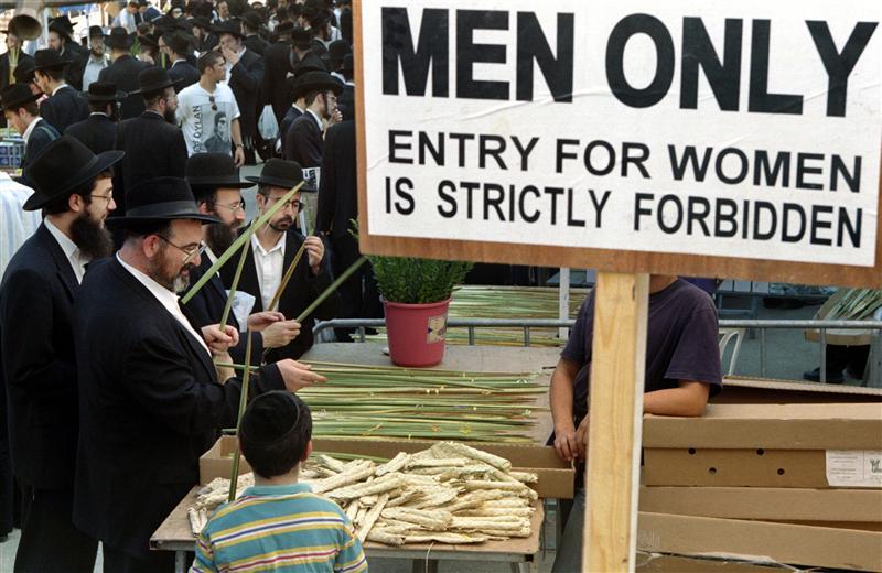 Ultra-Orthodox Jews shop for the "four species" in a special "men's only" market in the religious ne..