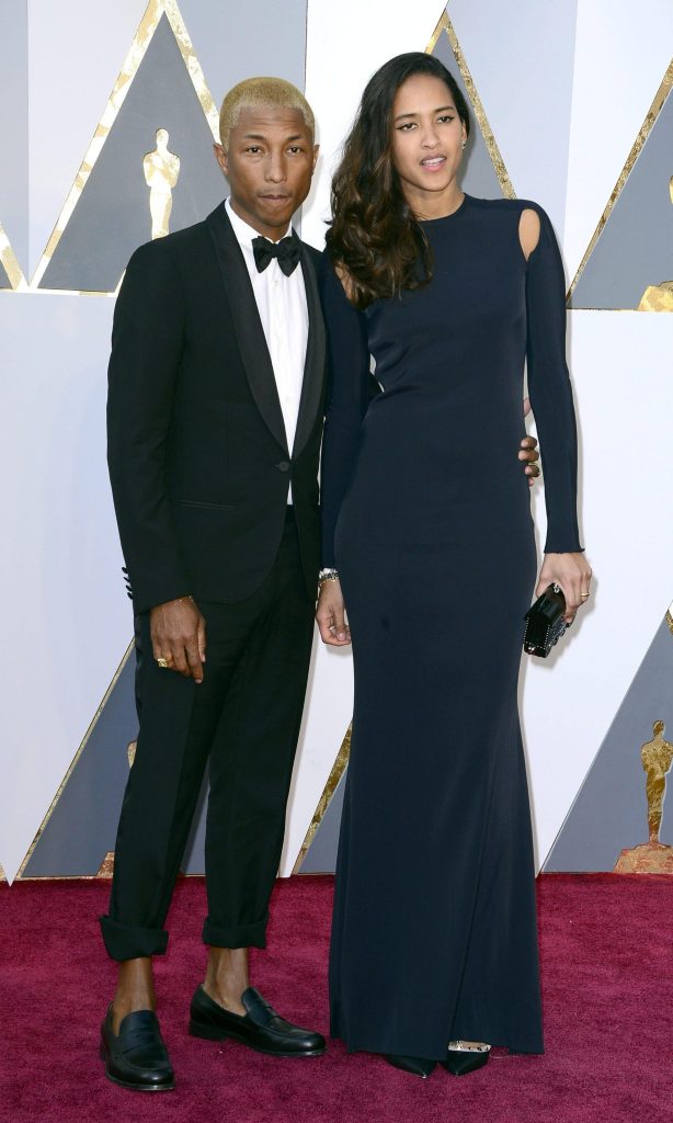 Pharrell Williams in Lanvin e la moglie Helen Lasichanh