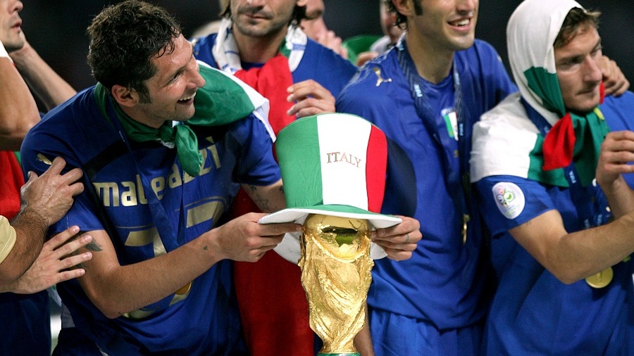 Italy's Marco Materazzi puts a hat on the trophy