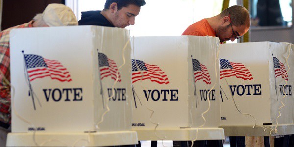 Alhambra residents vote on Election Day at the Alhambra Fire Station #71 in Alhambra, Los Angeles County, on November 6, 2012 in California, as Americans flock to the polls nationwide to decide between President Barack Obama, his Rebuplican challenger Mitt Romney, and a wide range of other issues. AFP PHOTO/Frederic J. BROWN (Photo credit should read FREDERIC J. BROWN/AFP/Getty Images)