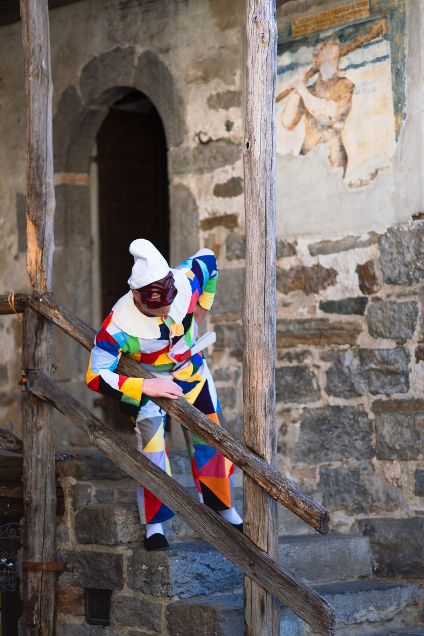 45855050_The mask of Arlecchino. on the stairs of Oneta's house. Valle Brembana. Bergamo. Italy